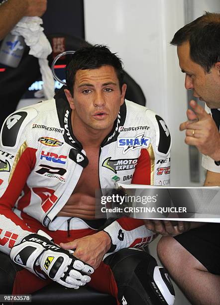 Honda's French rider Randy De Puniet sits in the pits during a free practice session at Jerez de la Frontera's circuit on April 30, 2010. The Spanish...