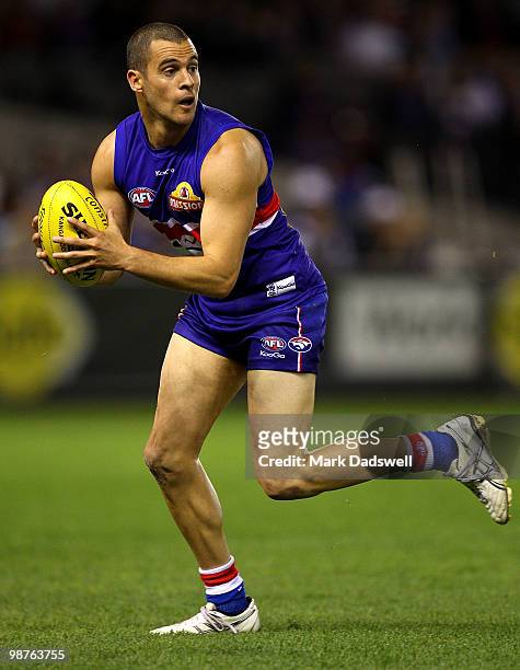 Lindsay Gilbee of the Bulldogs gathers the ball during the round six AFL match between the Western Bulldogs and the St Kilda Saints at Etihad Stadium...