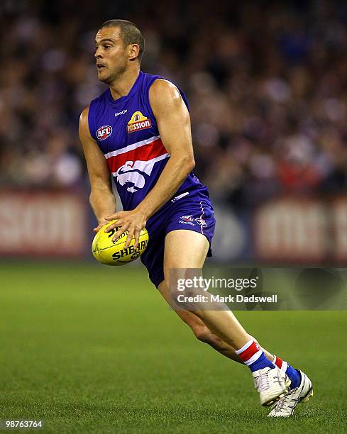 Lindsay Gilbee of the Bulldogs looks for a teammate during the round six AFL match between the Western Bulldogs and the St Kilda Saints at Etihad...