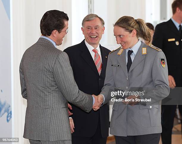 German President Horst Koehler and German Defense Minister Karl-Theodor zu Guttenberg awards bobsled driver Tatjana Huefner at the Silbernes...