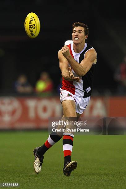 Lenny Hayes of the Saints handballs during the round six AFL match between the Western Bulldogs and the St Kilda Saints at Etihad Stadium on April...