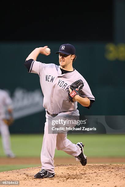 Phil Hughes of the New York Yankees pitching during the game against the Oakland Athletics at the Oakland Coliseum on April 21, 2010 in Oakland,...