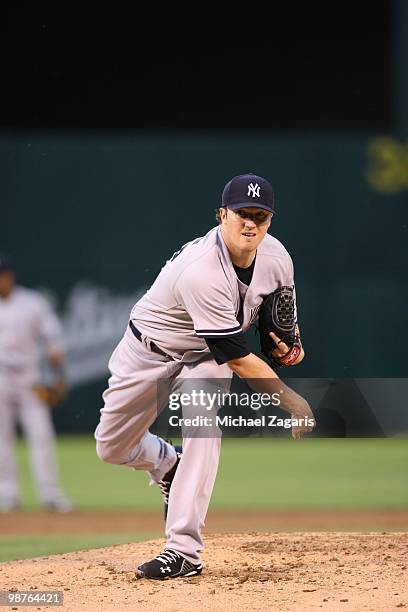 Phil Hughes of the New York Yankees pitching during the game against the Oakland Athletics at the Oakland Coliseum on April 21, 2010 in Oakland,...