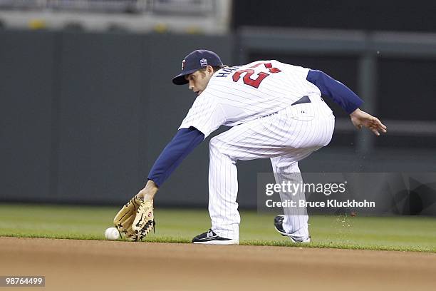 Hardy of the Minnesota Twins fields a ground ball from the Cleveland Indians on April 21, 2010 at Target Field in Minneapolis, Minnesota. The Twins...