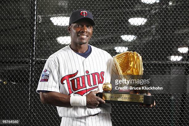 Orlando Hudson of the Minnesota Twins holds his 2009 Golden Glove Award prior to the game with the Cleveland Indians on April 21, 2010 at Target...