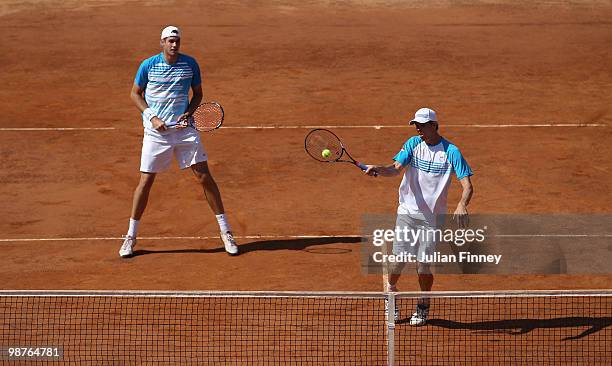 John Isner and Sam Querrey of USA in action in their doubles against Yves Allegro and Roger Federer of Switzerland during day six of the ATP Masters...