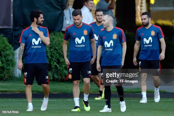 Andres Iniesta of Spain, Nacho Fernandez of Spain and Isco Alarcon of Spain look on during a training session on June 27, 2018 in Krasnodar, Russia.