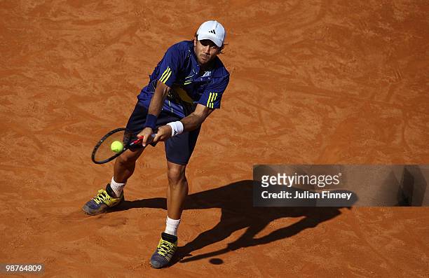 Fernando Verdasco of Spain plays a backhand in his match against Novak Djokovic of Serbia during day six of the ATP Masters Series - Rome at the Foro...