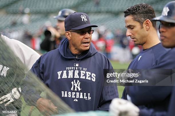 Special Assistant of the New York Yankees Reggie Jackson and Jorge Posada standing on the field prior to the game against the Oakland Athletics at...