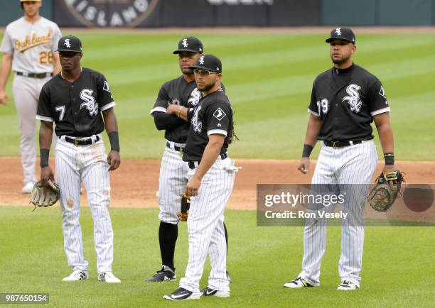 Tim Anderson, Yoan Moncada, Yolmer Sanchez and Jose Abreu of the Chicago White Sox look on during a pitching change against the Oakland Athletics...