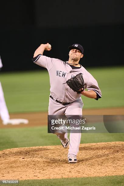 Joba Chamberlain of the New York Yankees pitching during the game against the Oakland Athletics at the Oakland Coliseum on April 21, 2010 in Oakland,...