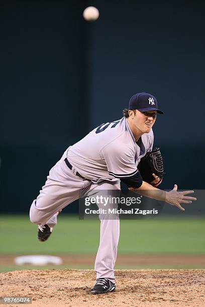 Phil Hughes of the New York Yankees pitching during the game against the Oakland Athletics at the Oakland Coliseum on April 21, 2010 in Oakland,...