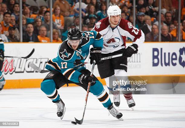 Chris Stewart of the Colorado Avalanche chases Torrey Mitchell of the San Jose Sharks in Game Five of the Western Conference Quarterfinals during the...