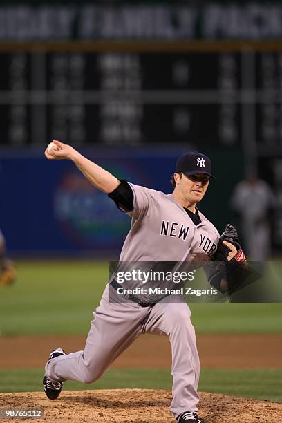 Phil Hughes of the New York Yankees pitching during the game against the Oakland Athletics at the Oakland Coliseum on April 21, 2010 in Oakland,...