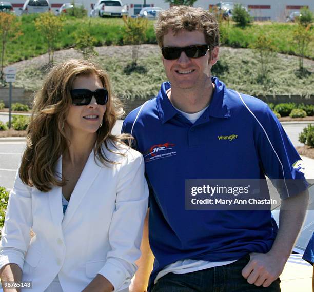 Dale Earnhardt Jr., co-owner of JR Motorsports, with Teresa Earnhardt, President and CEO Dale Earnhardt Inc., stand together after the unveiling of...