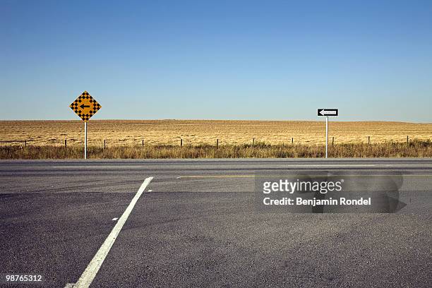 road signs on rural highway - benjamin rondel stock pictures, royalty-free photos & images