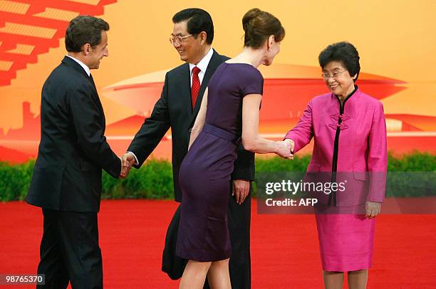 Fench President Nicolas Sarkozy and his wife Carla Bruni-Sarkozy are welcomed by Chinese President Hu Jintao and his wife Liu Yongqing as they arrive...