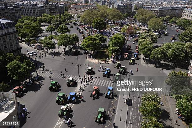 French farmers demonstrate with their tractors on April 27, 2010 in Paris to protest against wages cut and to denounce the European Farm Policy. The...