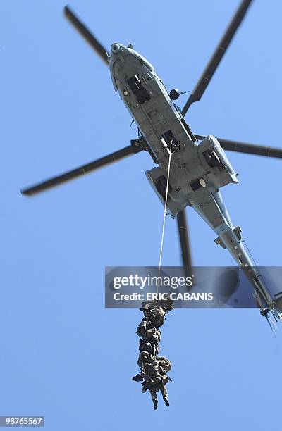 French Special Forces soldiers of the 4th Helicopters Regiment simulate a hostage-rescue operation on April 28 2010, in a military aera in Tarbes,...