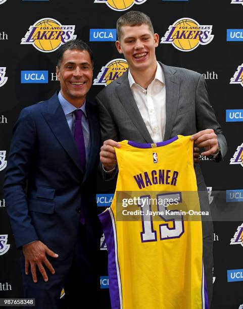 General manager Rob Pelinka of the Los Angeles Lakers stands with Moritz Wagner, one of the team's 2018 NBA draft picks, during an introductory press...