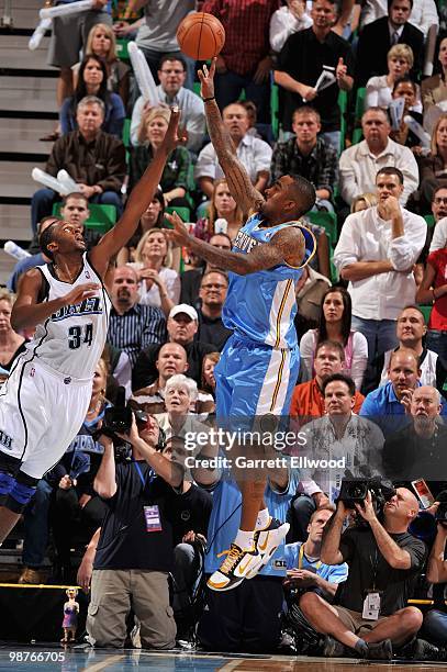 Smith of the Denver Nuggets puts a shot up over C.J. Miles of the Utah Jazz in Game Four of the Western Conference Quarterfinals during the 2010 NBA...