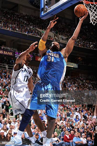 Nene of the Denver Nuggets lays the ball up over Ronnie Price of the Utah Jazz in Game Four of the Western Conference Quarterfinals during the 2010...