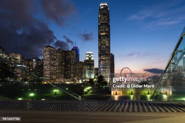 twilight over the skyscrapers of the central business district in hong kong island - didier marti stock pictures, royalty-free photos & images