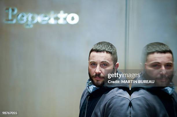 French ballet shoes company Repetto's designer Olivier Jault poses in front of a mirror on March 11, 2010 in Paris. Created in 1947 by Rose Repetto...