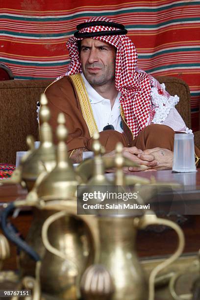 Goodwill Ambassador Luis Figo, dressed in traditional Jordanian arab clothing, sits in a tent during his visit to al-Noor hospital on April 30, 2010...