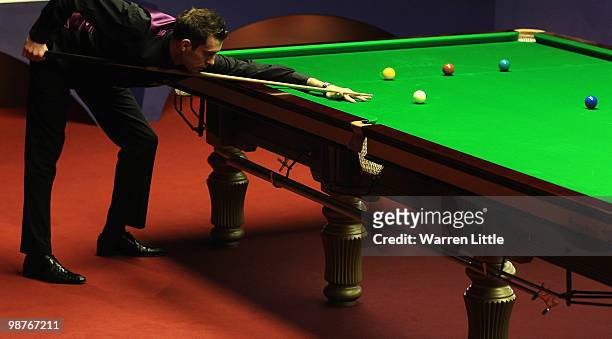 Mark Selby of England in action against Graeme Dott of Scotland during the semi final of the Betfred.com World Snooker Championships at The Crucible...