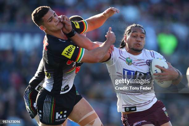 Martin Taupau of the Sea Eagles fends off Nathan Cleary of the Panthers during the round 16 NRL match between the Penrith Panthers and the Manly Sea...