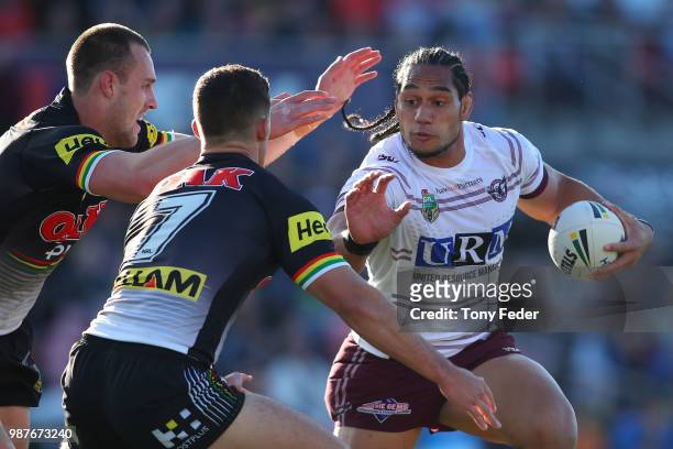 Martin Taupau of the Sea Eagles fends off Nathan Cleary of the Panthers during the round 16 NRL match between the Penrith Panthers and the Manly Sea...