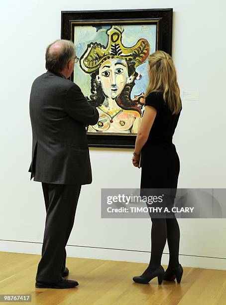 Painting titled "Femme Au Grand Chapeau Buste" by Pablo Picasso during a press preview April 30, 2010 at Sotheby's New York for their spring sales of...