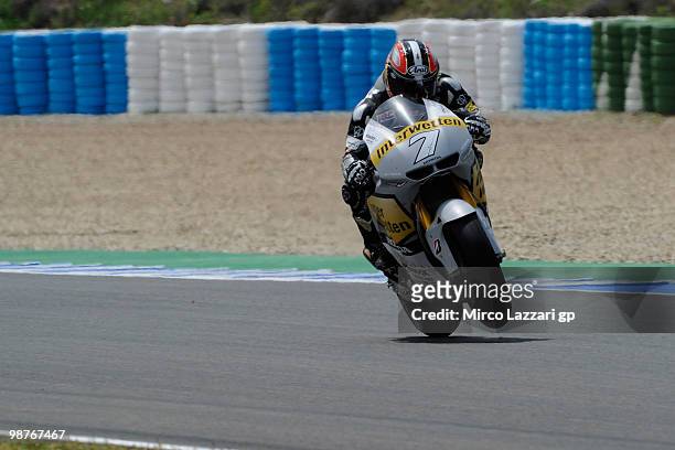 Hiroshi Aoyama of Japan and Interwetten MotoGP Team lifts the front wheel during the first free practice at Circuito de Jerez on April 30, 2010 in...