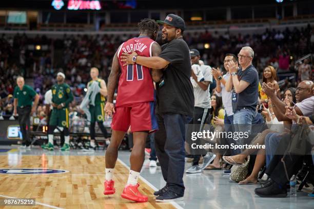 League Co-Founder and entertainer, Ice Cube congratulates Nate Robinson of Tri-State after a game in week two of the BIG3 three on three basketball...