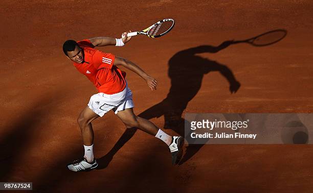 Jo-Wilfried Tsonga of France plays a shot behind his back in his match against David Ferrer of Spain during day six of the ATP Masters Series - Rome...