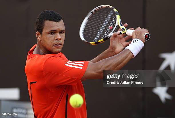 Jo-Wilfried Tsonga of France plays a backhand in his match against David Ferrer of Spain during day six of the ATP Masters Series - Rome at the Foro...