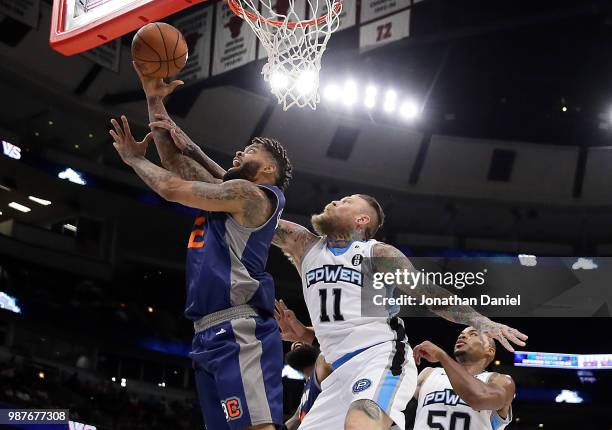 Andre Emmett of 3's Company shoots against Chris Andersen of Power during week two of the BIG3 three on three basketball league at United Center on...