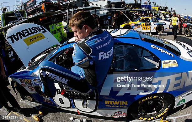 Carl Edwards, driver of the Fastenal Ford, climbs out of his car during practice for the Bubba Burger 250 at Richmond International Raceway on April...