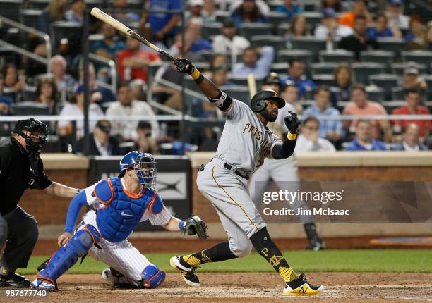 Gregory Polanco of the Pittsburgh Pirates follows through on a seventh inning home run against the New York Mets at Citi Field on June 26, 2018 in...