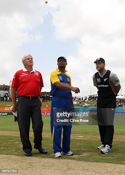 Kumar Sangakkara of Sri Lanka and Daniel Vettori of New Zealand partcipate in the coin toss prior to the ICC T20 World Cup Group B match between Sri...