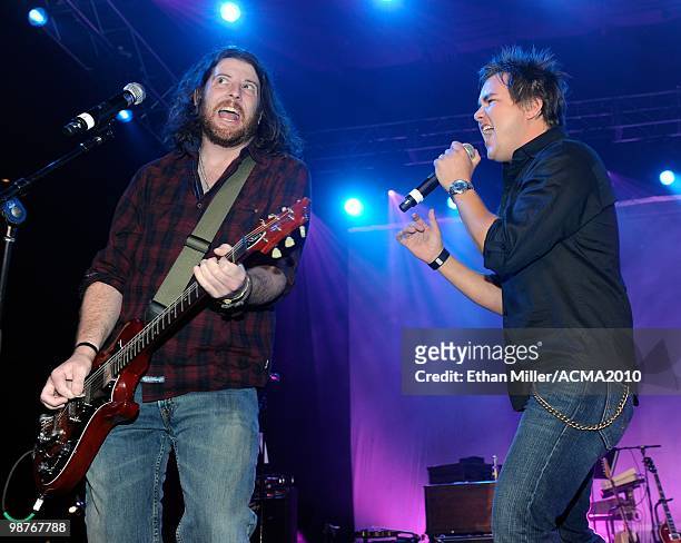 Guitarist James Young and frontman Mike Eli of the Eli Young Band perform during the Academy of Country Music Awards All-Star Jam at the MGM Grand...