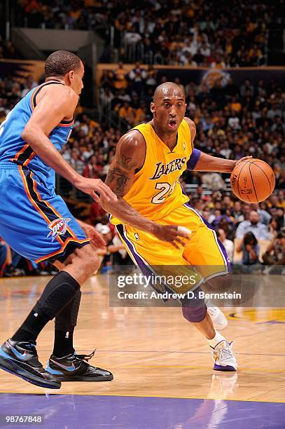 Kobe Bryant of the Los Angeles Lakers drives to the basket against Thabo Sefolosha of the Oklahoma City Thunder in Game Five of the Western...