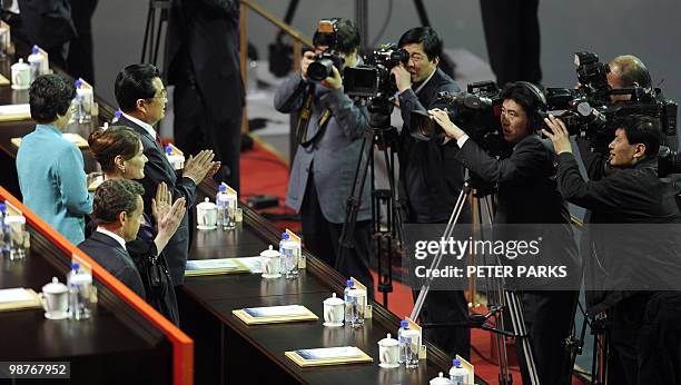 Chinese President Hu Jintao , his wife Liu Yongqing , French President Nicolas Sarkozy and his wife Carla Bruni attend the opening ceremony of the...