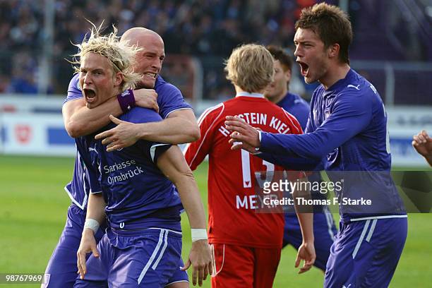 Dennis Schmidt, Tobias Nickenig and Niels Hansen of Osnabrueck celebrate during the Third League match between VfL Osnabrueck and Holstein Kiel at...