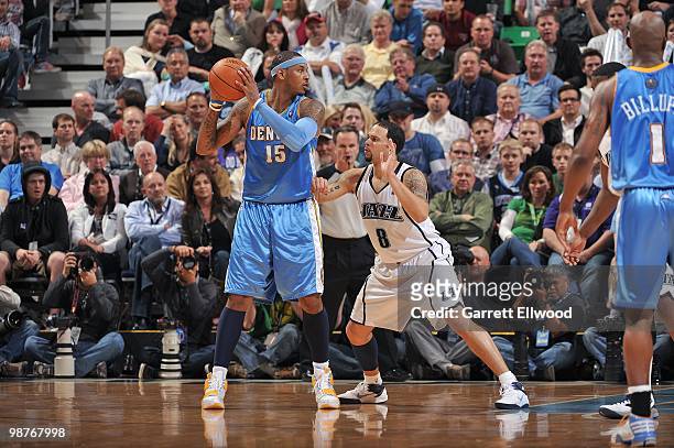 Carmelo Anthony of the Denver Nuggets looks to move the ball against Deron Williams of the Utah Jazz in Game Three of the Western Conference...