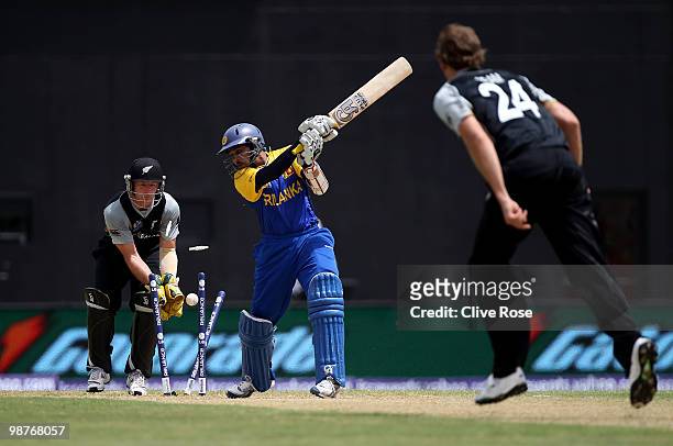 Tillakaratne Dilshan of Sri Lanka is clean bowled by Jacob Oram of New Zealand during The ICC T20 World Cup Group B match between Sri Lanka and New...