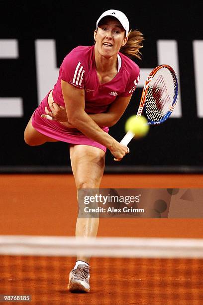 Justine Henin of Belgium serves the ball during her quarter final match against Jelena Jankovic of Serbia at day five of the WTA Porsche Tennis Grand...