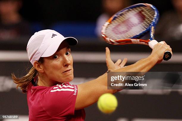 Justine Henin of Belgium plays a backhand during her quarter final match against Jelena Jankovic of Serbia at day five of the WTA Porsche Tennis...