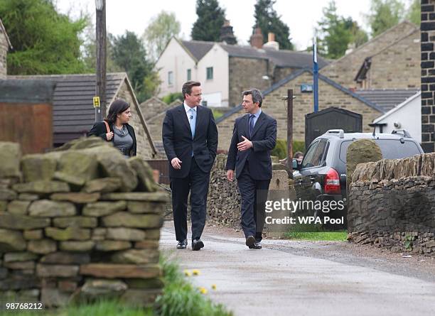Britain's opposition Conservative Party leader, David Cameron, walks with candidate for Penistone and Stocksbridge, Spencer Pitfield, in...